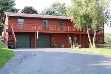 Welcome to this 3 bedroom, 3 bath live edge cedar sided home on Lake Carroll Golf Course in Illinois - for sale on GolfHomes.com, golf home, golf lot