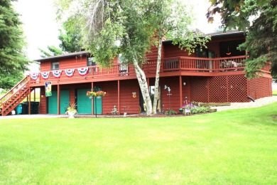 Welcome to this 3 bedroom, 3 bath live edge cedar sided home on Lake Carroll Golf Course in Illinois - for sale on GolfHomes.com, golf home, golf lot