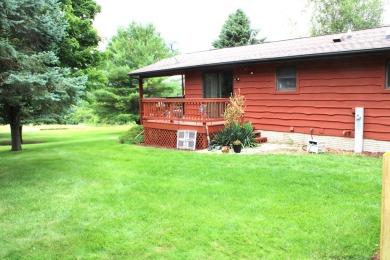 Welcome to this 3 bedroom, 3 bath live edge cedar sided home on Lake Carroll Golf Course in Illinois - for sale on GolfHomes.com, golf home, golf lot