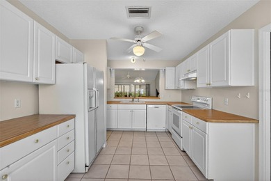 FABULOUS TURNKEY 3/2 San Miguel (Wisteria/Jasmine) with SCREENED on El Diablo Executive Golf Course in Florida - for sale on GolfHomes.com, golf home, golf lot