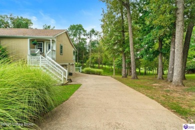 Experience tranquility and comfort in Brandenburg's premier on Doe Valley Country Club in Kentucky - for sale on GolfHomes.com, golf home, golf lot