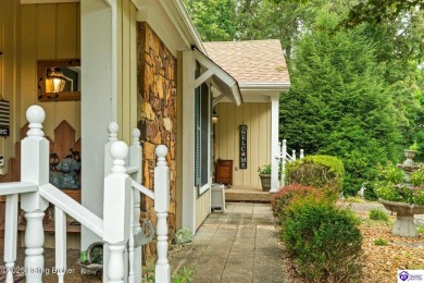 Experience tranquility and comfort in Brandenburg's premier on Doe Valley Country Club in Kentucky - for sale on GolfHomes.com, golf home, golf lot