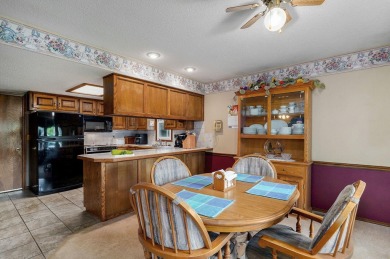 This one's been loved and it shows. Solid all brick home with on Horton Smith Golf Course in Missouri - for sale on GolfHomes.com, golf home, golf lot