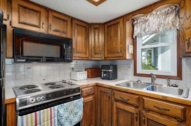 This one's been loved and it shows. Solid all brick home with on Horton Smith Golf Course in Missouri - for sale on GolfHomes.com, golf home, golf lot