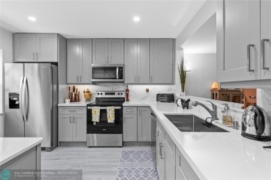 Completely remodeled in 2023, this 2-bedroom, 2.5-bath lakefront on Palm-Aire Country Club and Resort - Palms in Florida - for sale on GolfHomes.com, golf home, golf lot