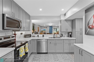 Completely remodeled in 2023, this 2-bedroom, 2.5-bath lakefront on Palm-Aire Country Club and Resort - Palms in Florida - for sale on GolfHomes.com, golf home, golf lot
