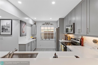 Completely remodeled in 2023, this 2-bedroom, 2.5-bath lakefront on Palm-Aire Country Club and Resort - Palms in Florida - for sale on GolfHomes.com, golf home, golf lot