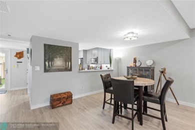 Completely remodeled in 2023, this 2-bedroom, 2.5-bath lakefront on Palm-Aire Country Club and Resort - Palms in Florida - for sale on GolfHomes.com, golf home, golf lot