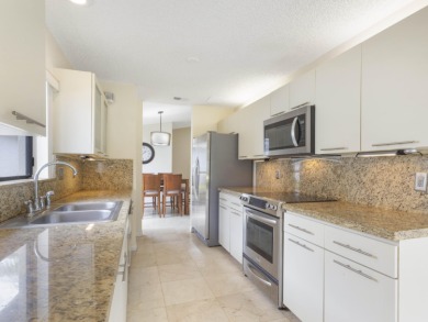 Enjoy the Boca Woods lifestyle in this beautiful Pinewood model on Boca Woods Country Club in Florida - for sale on GolfHomes.com, golf home, golf lot