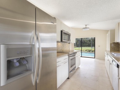 Enjoy the Boca Woods lifestyle in this beautiful Pinewood model on Boca Woods Country Club in Florida - for sale on GolfHomes.com, golf home, golf lot