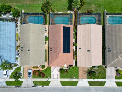 Enjoy the Boca Woods lifestyle in this beautiful Pinewood model on Boca Woods Country Club in Florida - for sale on GolfHomes.com, golf home, golf lot