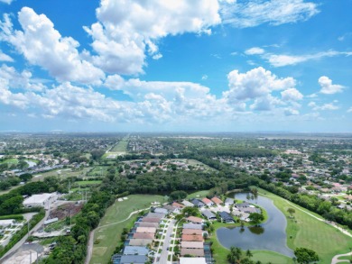 Enjoy the Boca Woods lifestyle in this beautiful Pinewood model on Boca Woods Country Club in Florida - for sale on GolfHomes.com, golf home, golf lot