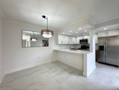 Newly renovated and move-in ready. This spacious 2-bedroom, 2 on Pine Island Ridge Country Club in Florida - for sale on GolfHomes.com, golf home, golf lot