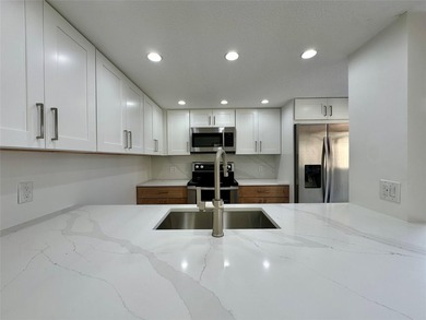 Newly renovated and move-in ready. This spacious 2-bedroom, 2 on Pine Island Ridge Country Club in Florida - for sale on GolfHomes.com, golf home, golf lot