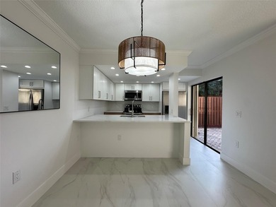 Newly renovated and move-in ready. This spacious 2-bedroom, 2 on Pine Island Ridge Country Club in Florida - for sale on GolfHomes.com, golf home, golf lot