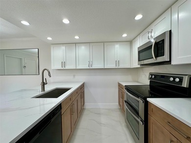 Newly renovated and move-in ready. This spacious 2-bedroom, 2 on Pine Island Ridge Country Club in Florida - for sale on GolfHomes.com, golf home, golf lot