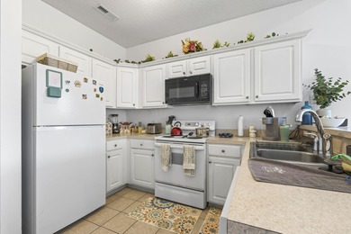 Welcome to this beautiful 2-bedroom, 2-bathroom top-floor end on Palmetto Greens Golf and Country Club in South Carolina - for sale on GolfHomes.com, golf home, golf lot