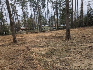 This is a cleared but wooded, 1+acre lot in the Pendleton Harbor on Pendleton Harbor in Texas - for sale on GolfHomes.com, golf home, golf lot