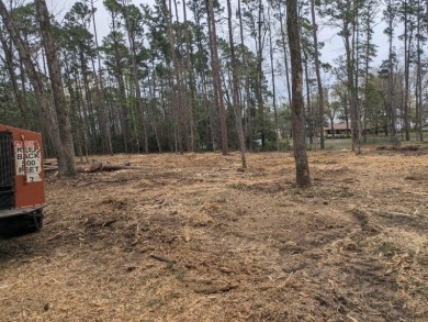 This is a cleared but wooded, 1+acre lot in the Pendleton Harbor on Pendleton Harbor in Texas - for sale on GolfHomes.com, golf home, golf lot