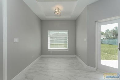 Experience elevated living in this exquisite 3 bed, 2 bath home on South Padre Island Golf Club in Texas - for sale on GolfHomes.com, golf home, golf lot
