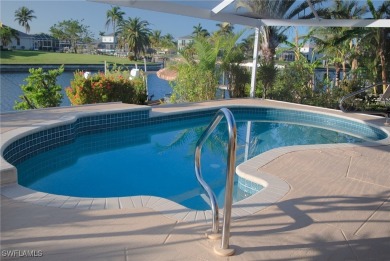 Highly sought-after SW Cape area GULF ACCESS POOL HOME! BOASTS on Royal Tee Country Club in Florida - for sale on GolfHomes.com, golf home, golf lot