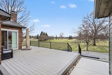 This completely updated Colonial overlooking the #12 Green at on Travis Pointe Country Club in Michigan - for sale on GolfHomes.com, golf home, golf lot