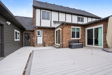 This completely updated Colonial overlooking the #12 Green at on Travis Pointe Country Club in Michigan - for sale on GolfHomes.com, golf home, golf lot