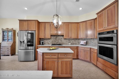 This elegant David Weekley home offers panoramic water views on The Palencia Club in Florida - for sale on GolfHomes.com, golf home, golf lot