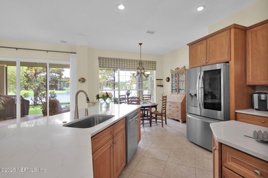 This elegant David Weekley home offers panoramic water views on The Palencia Club in Florida - for sale on GolfHomes.com, golf home, golf lot