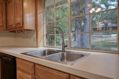 Welcome home to this beautiful 3-bedroom, 2-bathroom retreat on Hide-A-Way Lake Golf Course in Texas - for sale on GolfHomes.com, golf home, golf lot