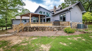Lakefront Home w/boat slip & lift behind the house.  This is the for sale on GolfHomes.com