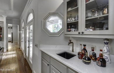 Experience timeless Southern charm blended beautifully with on Annandale Golf Club in Mississippi - for sale on GolfHomes.com, golf home, golf lot