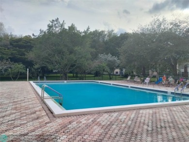 LIVE IN PRESTIGIOUS CAYMAN WAY ON AVENUE OF THE STARS! STEPS TO on Wynmoor Golf Course in Florida - for sale on GolfHomes.com, golf home, golf lot