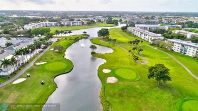 LIVE IN PRESTIGIOUS CAYMAN WAY ON AVENUE OF THE STARS! STEPS TO on Wynmoor Golf Course in Florida - for sale on GolfHomes.com, golf home, golf lot