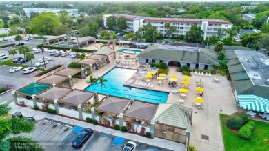 LIVE IN PRESTIGIOUS CAYMAN WAY ON AVENUE OF THE STARS! STEPS TO on Wynmoor Golf Course in Florida - for sale on GolfHomes.com, golf home, golf lot