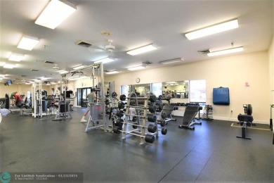 LIVE IN PRESTIGIOUS CAYMAN WAY ON AVENUE OF THE STARS! STEPS TO on Wynmoor Golf Course in Florida - for sale on GolfHomes.com, golf home, golf lot