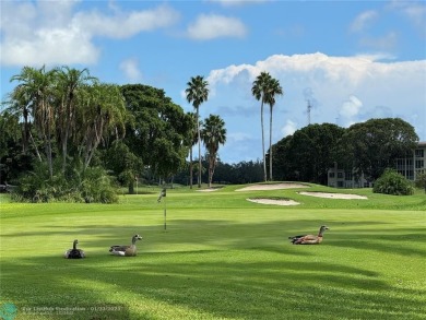 LIVE IN PRESTIGIOUS CAYMAN WAY ON AVENUE OF THE STARS! STEPS TO on Wynmoor Golf Course in Florida - for sale on GolfHomes.com, golf home, golf lot