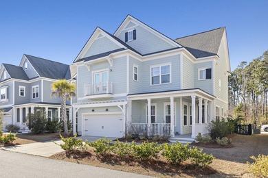 Welcome home to this light-filled coastal retreat tucked inside on Dunes West Golf Club in South Carolina - for sale on GolfHomes.com, golf home, golf lot