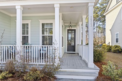 Welcome home to this light-filled coastal retreat tucked inside on Dunes West Golf Club in South Carolina - for sale on GolfHomes.com, golf home, golf lot