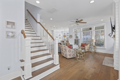 Welcome home to this light-filled coastal retreat tucked inside on Dunes West Golf Club in South Carolina - for sale on GolfHomes.com, golf home, golf lot