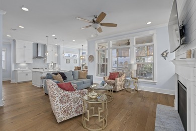 Welcome home to this light-filled coastal retreat tucked inside on Dunes West Golf Club in South Carolina - for sale on GolfHomes.com, golf home, golf lot