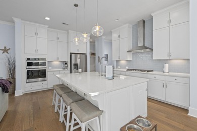 Welcome home to this light-filled coastal retreat tucked inside on Dunes West Golf Club in South Carolina - for sale on GolfHomes.com, golf home, golf lot