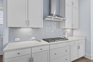 Welcome home to this light-filled coastal retreat tucked inside on Dunes West Golf Club in South Carolina - for sale on GolfHomes.com, golf home, golf lot