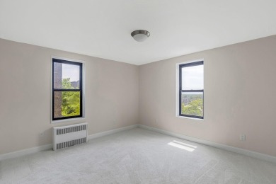 Fully renovated two-bedroom, one-bathroom end unit with elevator on Forest Park Golf Course in New York - for sale on GolfHomes.com, golf home, golf lot