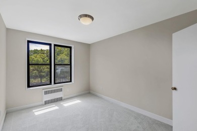 Fully renovated two-bedroom, one-bathroom end unit with elevator on Forest Park Golf Course in New York - for sale on GolfHomes.com, golf home, golf lot