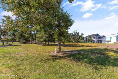 Discover your perfect beach escape in this hidden gem, nestled on Oak Island Golf Club in North Carolina - for sale on GolfHomes.com, golf home, golf lot