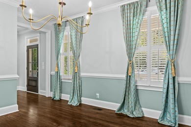 Enjoy sweeping lake views and an exceptional location just steps on Great Waters Course At Reynolds Plantation in Georgia - for sale on GolfHomes.com, golf home, golf lot