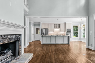 Enjoy sweeping lake views and an exceptional location just steps on Great Waters Course At Reynolds Plantation in Georgia - for sale on GolfHomes.com, golf home, golf lot