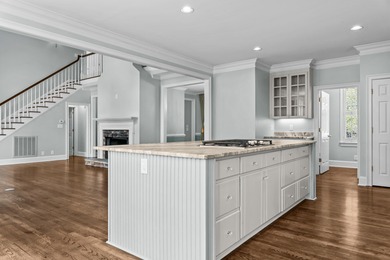 Enjoy sweeping lake views and an exceptional location just steps on Great Waters Course At Reynolds Plantation in Georgia - for sale on GolfHomes.com, golf home, golf lot