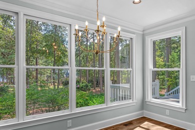 Enjoy sweeping lake views and an exceptional location just steps on Great Waters Course At Reynolds Plantation in Georgia - for sale on GolfHomes.com, golf home, golf lot